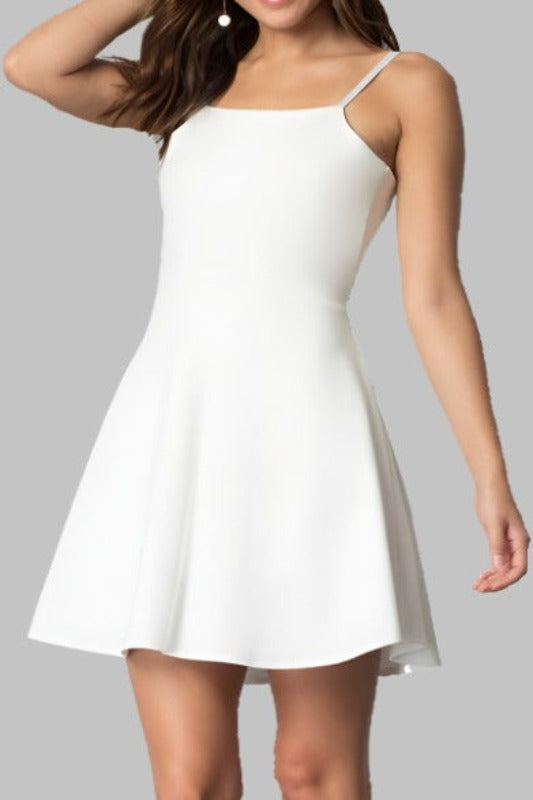 Elegant white mini dress with adjustable spaghetti straps.