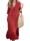 Red V-neck maxi dress with side pockets and flowy fit.