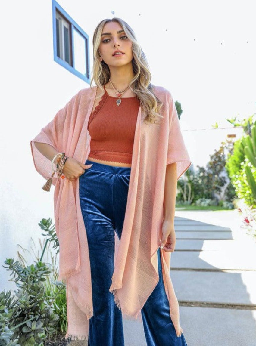 Pink kimono crafted from high-quality, soft fabric.
