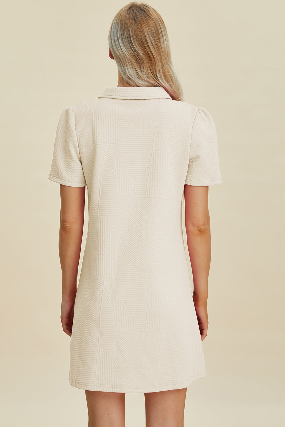 Ivory dress with textured pattern and classic collar