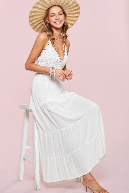 Dreamy white dress with a tiered skirt and lace detailing