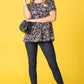 Black peplum blouse with intricate pink paisley print