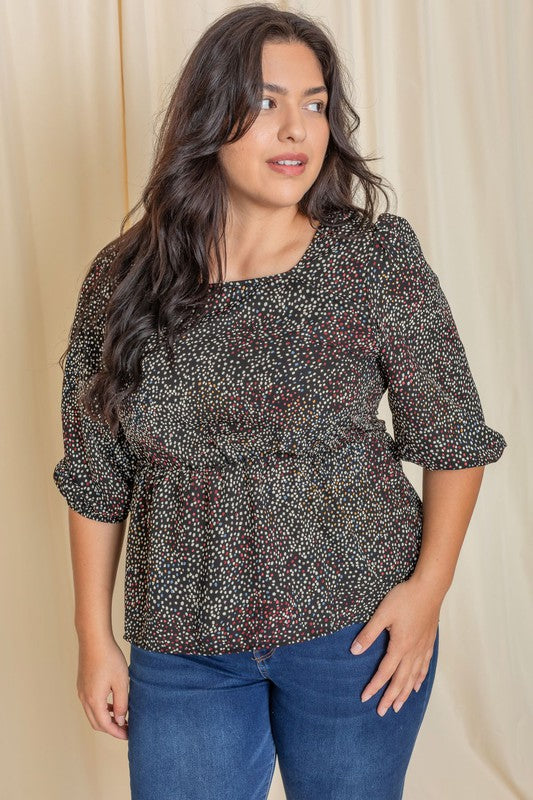 Chic black peplum blouse with colorful dots