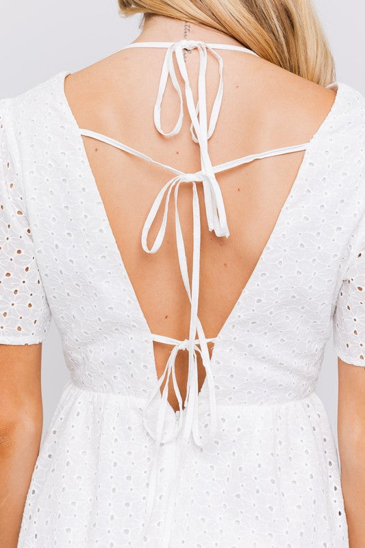 White summer dress with eyelet details and front tie closure