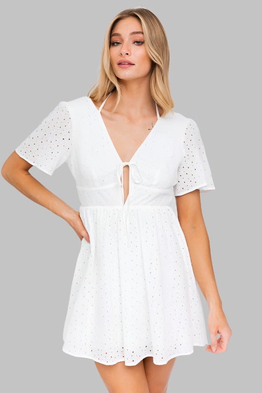 White eyelet dress with short sleeves and front tie detail