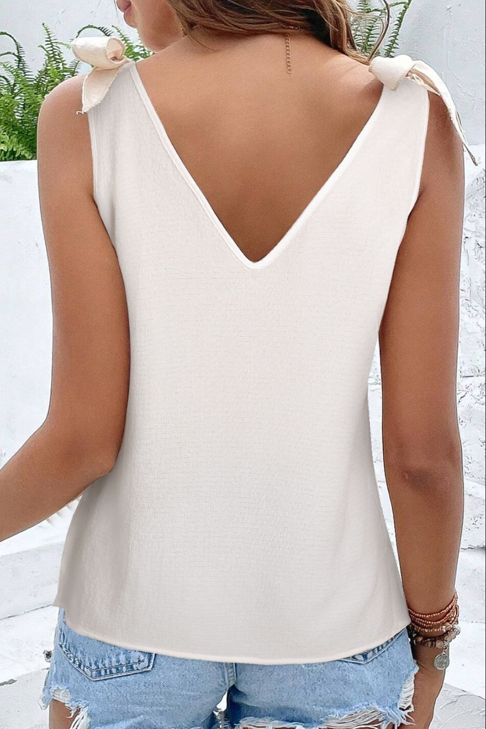 Boho-chic white tank top with eye-catching front embroidery