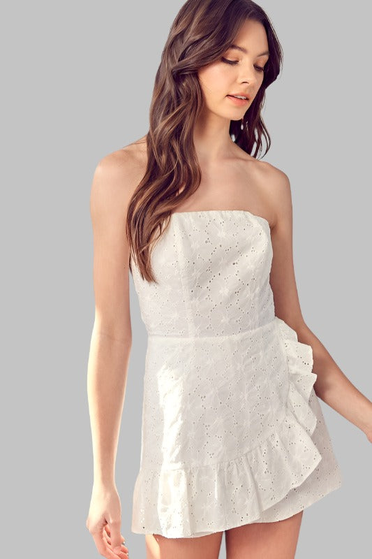 White strapless eyelet romper with zip closure.