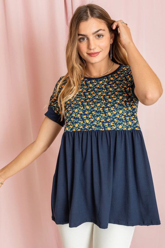 Plus size navy floral baby doll tunic featuring a flowy design & short sleeves