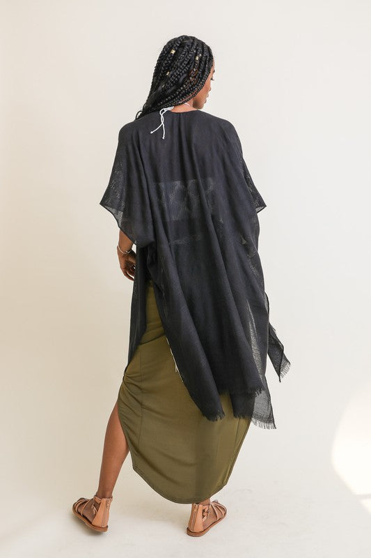 Black kimono with soft, luxurious fabric.