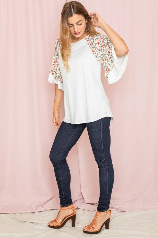 Plus size floral print ruffle sleeve white blouse.