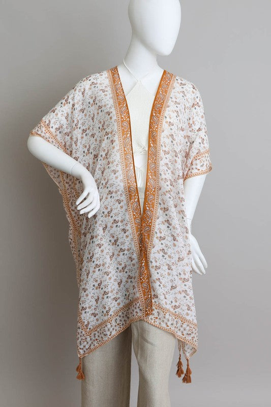 Lightweight and flowy kimono with bohemian patterns and tassels.