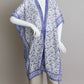 Bohemian kimono with intricate blue designs and flowy fabric.