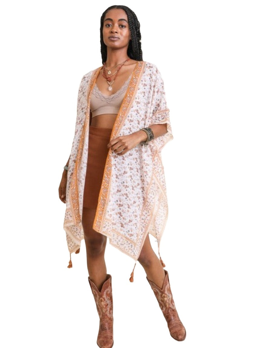 Lightweight sheer kimono with bohemian patterns in yellow and orange.