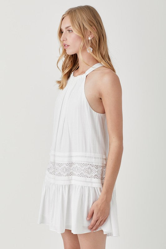 Chic white lace trim dress ideal for casual outings.