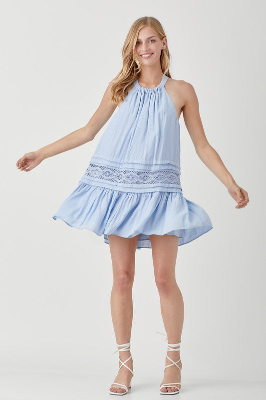 Light blue dress featuring a halter neckline and lace details.