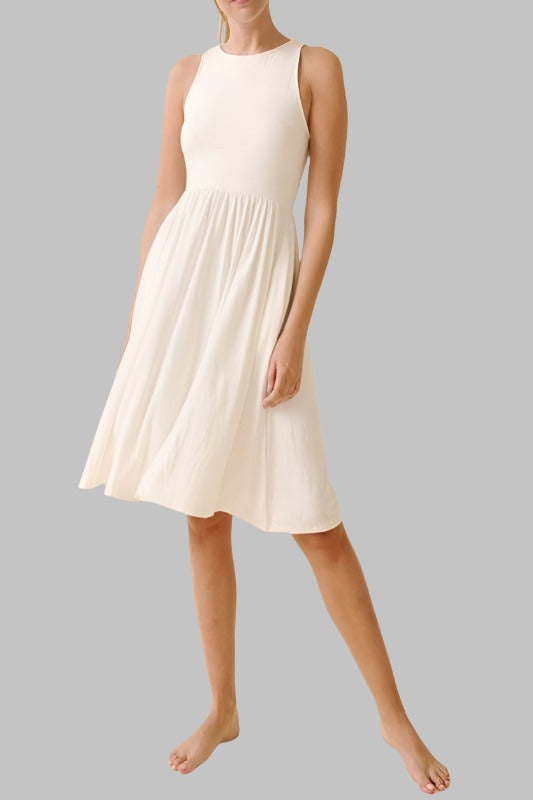 Sleeveless white dress made from organic bamboo spandex, shown front view.