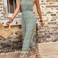 Floral print jumpsuit with elastic waistband and wide-leg cut.