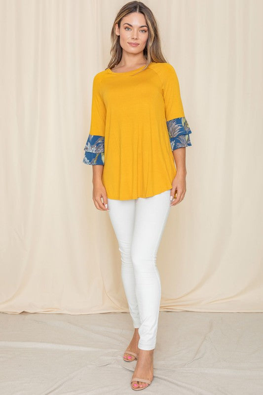 Bright yellow A-line top with floral patterned sleeves