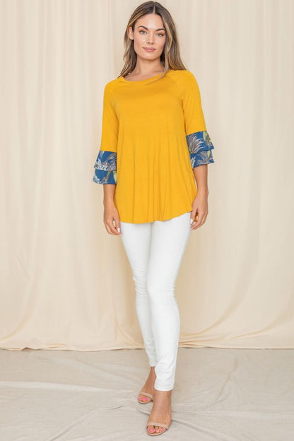 Bright yellow A-line top with floral patterned sleeves