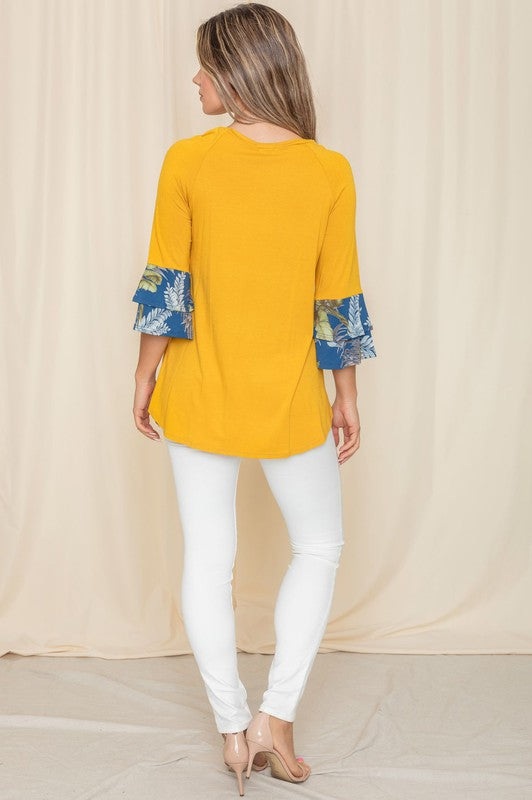 Yellow shirt with unique floral print sleeves