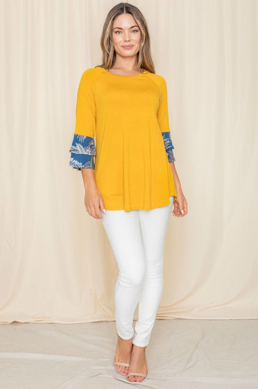 Yellow blouse with floral print sleeves