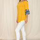 Casual yellow top with contrasting floral sleeves