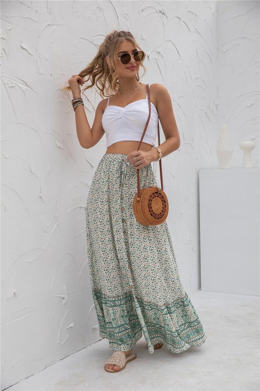 Green maxi skirt with vibrant floral pattern and adjustable waist