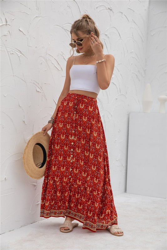 Red boho-chic maxi skirt with tiered hem and floral design