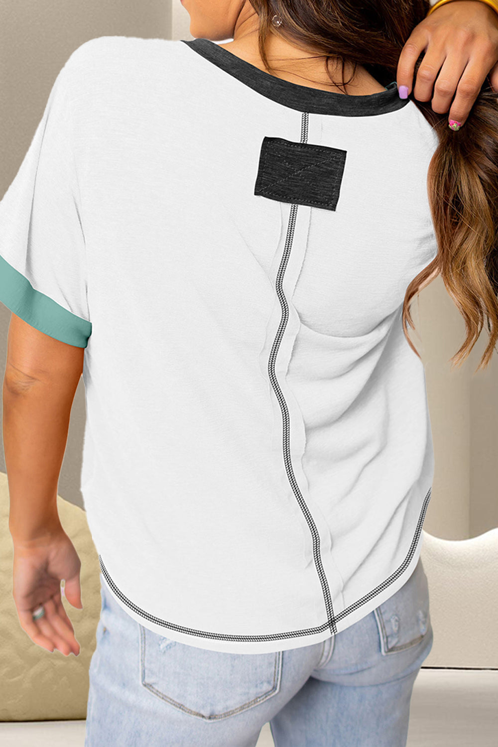 Stylish white V-neck tee with black and aqua color block details.