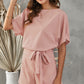 Chic Tie Belt Romper with a flattering fit, perfect for easy styling on warm days or upscale casual events.