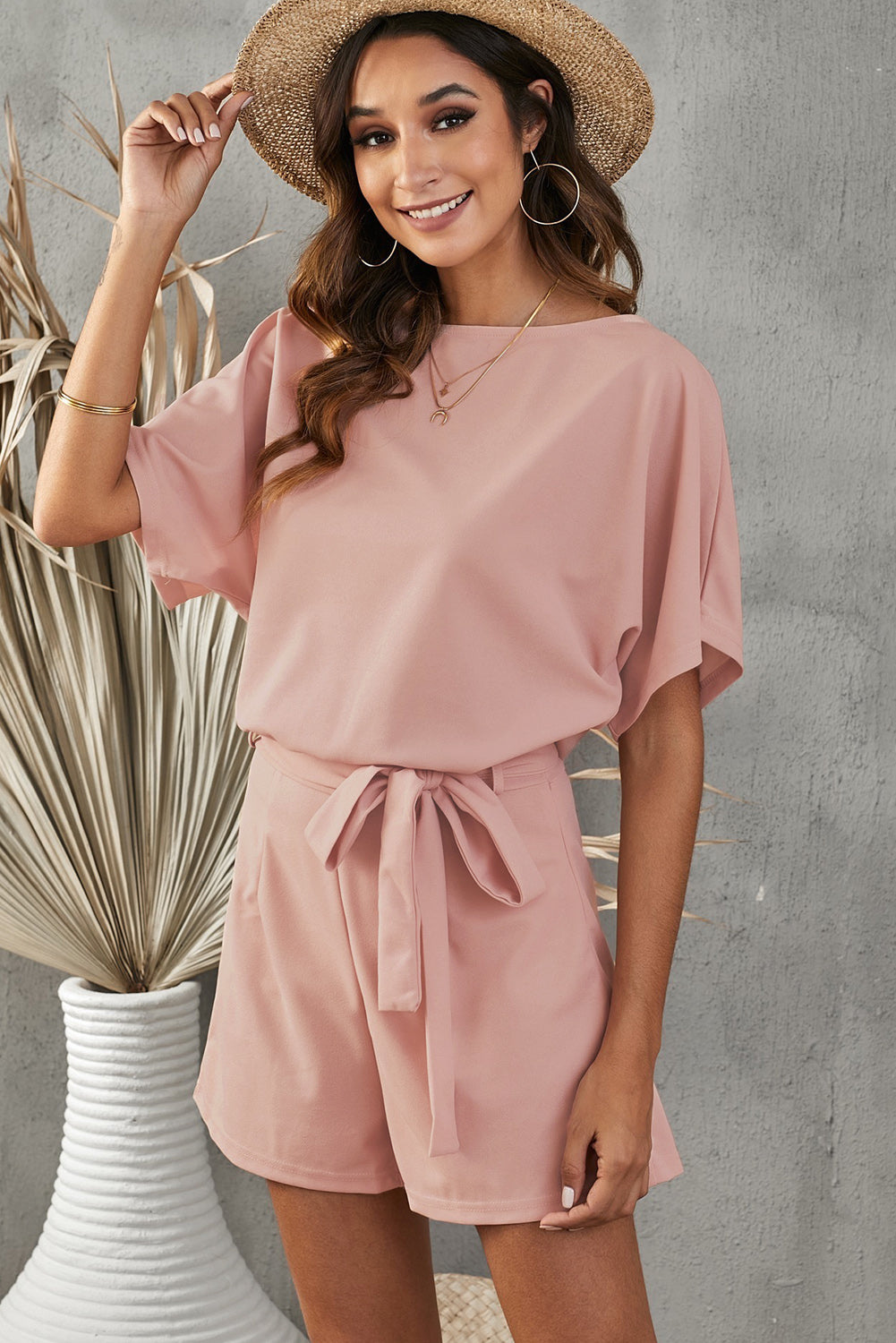 Chic Tie Belt Romper with a flattering fit, perfect for easy styling on warm days or upscale casual events.