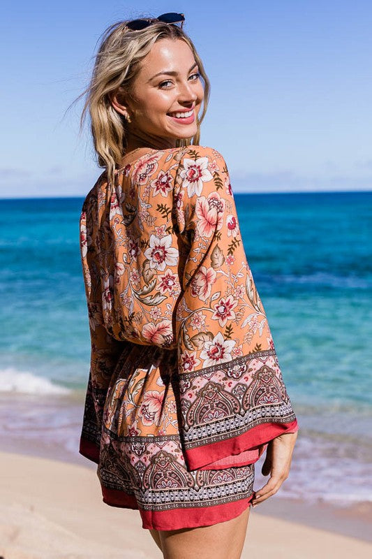 Floral romper with elastic waist and bell sleeves