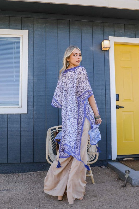 Boho chic sheer kimono with intricate blue designs.