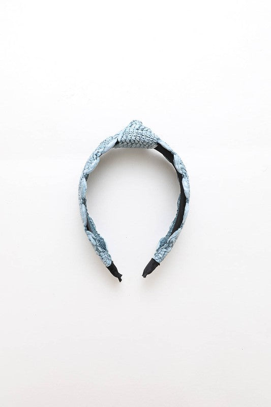 Blue woven headband with intricate design