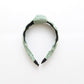 Green braided headband with comfortable fit