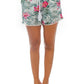 Fashionable tropical floral shorts paired with a simple top for a chic summer outfit
