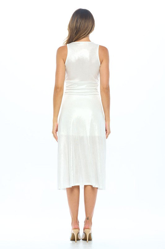 White dress featuring a sleek design with sleeveless style