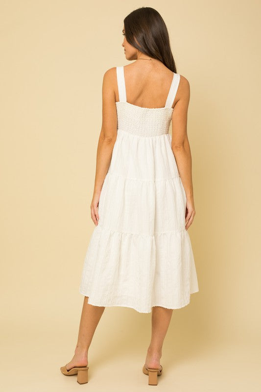 White summer dress with tiered skirt and wide shoulder straps