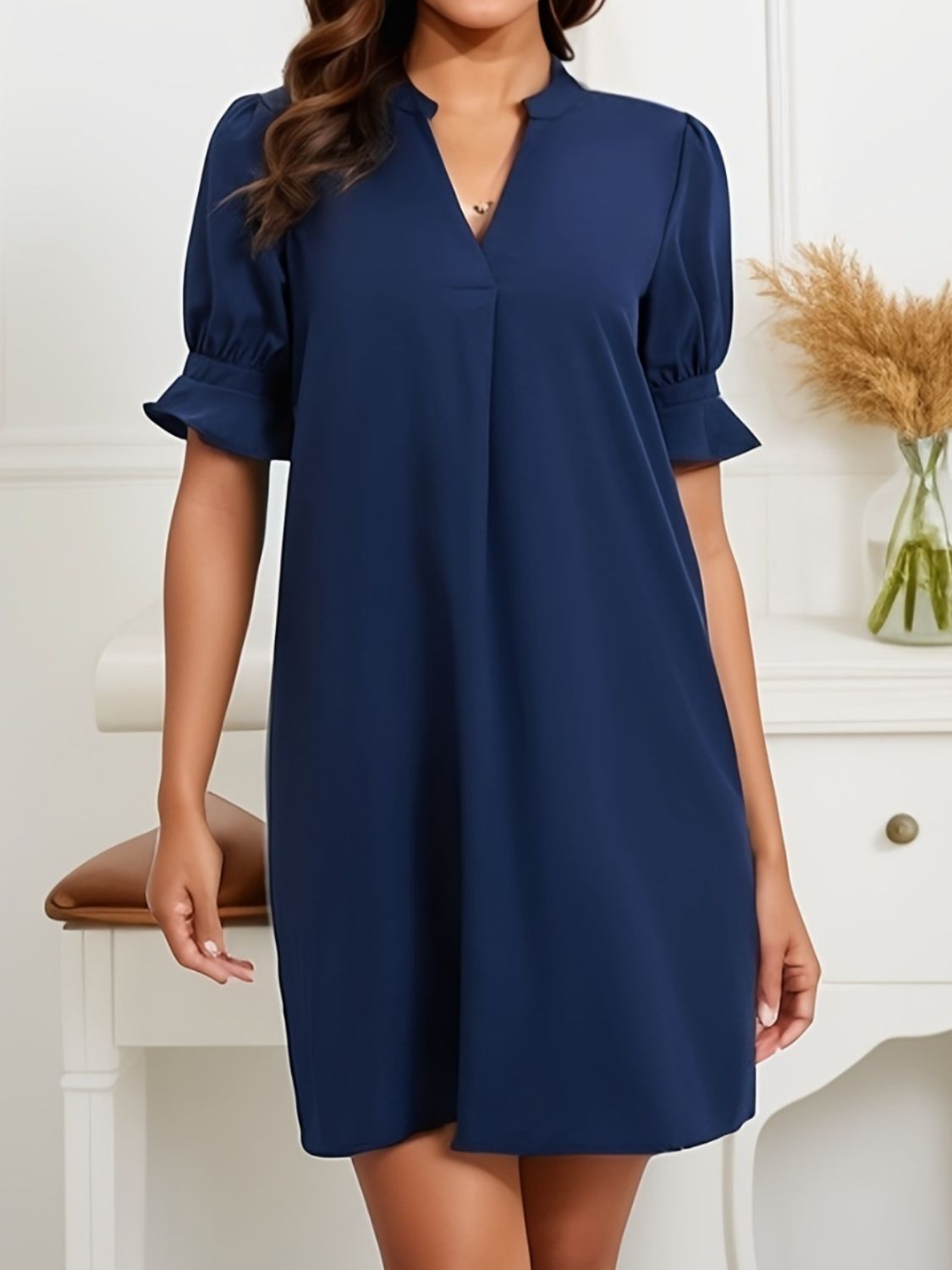 Stylish mini dress with flounce sleeves and a notched neckline, available in multiple colors for any event, casual or formal.