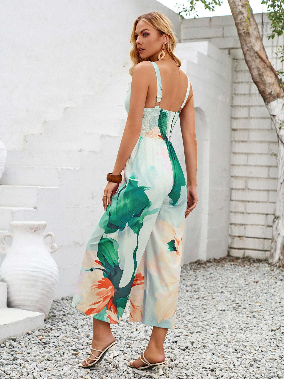 Embrace summer with our Cutout Jumpsuit featuring a vivid print, breezy fabric, and a flattering silhouette for effortless style.