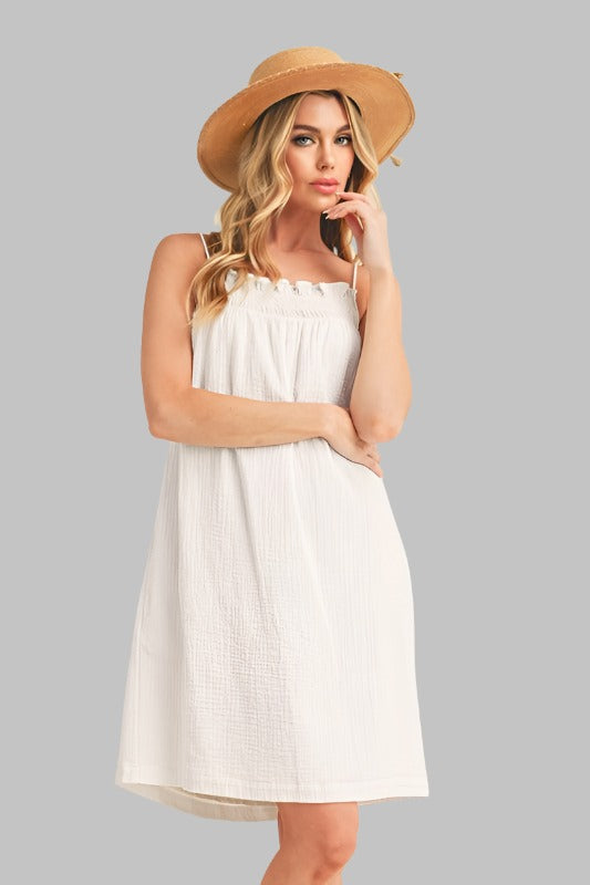 Chic white sundress ideal for casual outings, featuring a relaxed fit