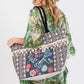 Spacious tote bag featuring beaded dragonfly and floral designs, and tassel detailing