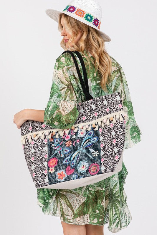 Spacious tote bag featuring beaded dragonfly and floral designs, and tassel detailing