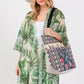 Dragonfly and tassel beaded tote bag with vibrant patterns and black handles