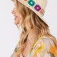 Chic straw sun hat with decorative embroidery.