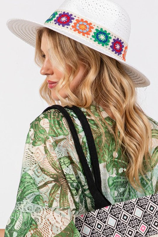 Stylish wide-brimmed hat with bright embroidered accents.