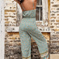 Summer jumpsuit with adjustable straps and bohemian border detail.