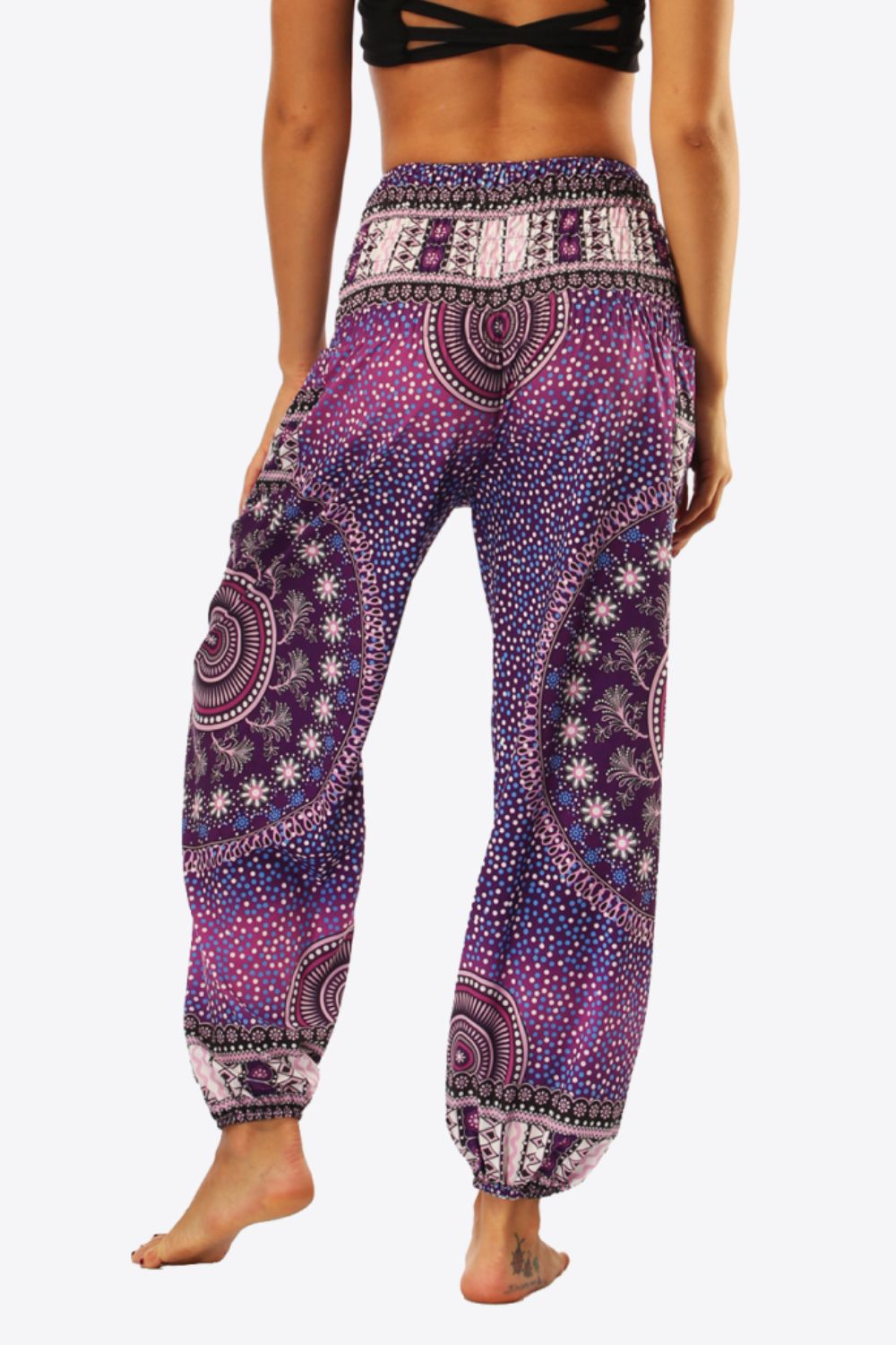 Vibrant purple boho harem pants with intricate patterns.