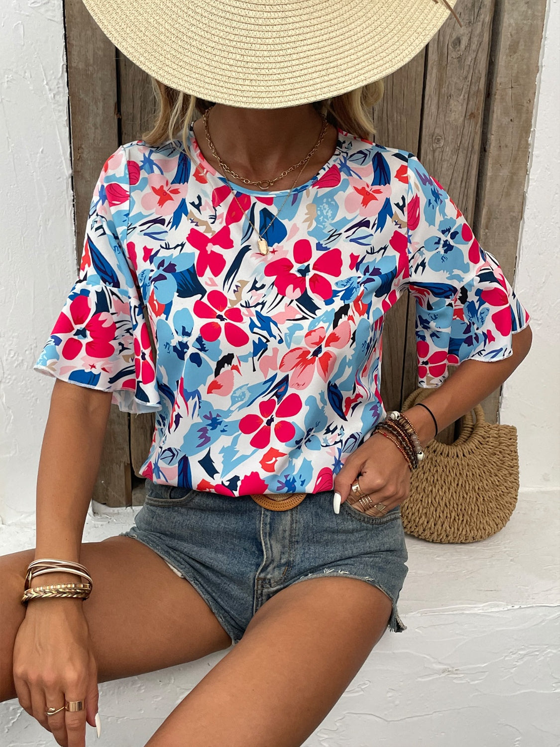 Flaunt style with our Printed Blouse featuring flounce sleeves, a round neck, and vibrant hues perfect for any occasion. Shop now!