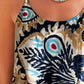 Boho chic sleeveless top with eye-catching print.